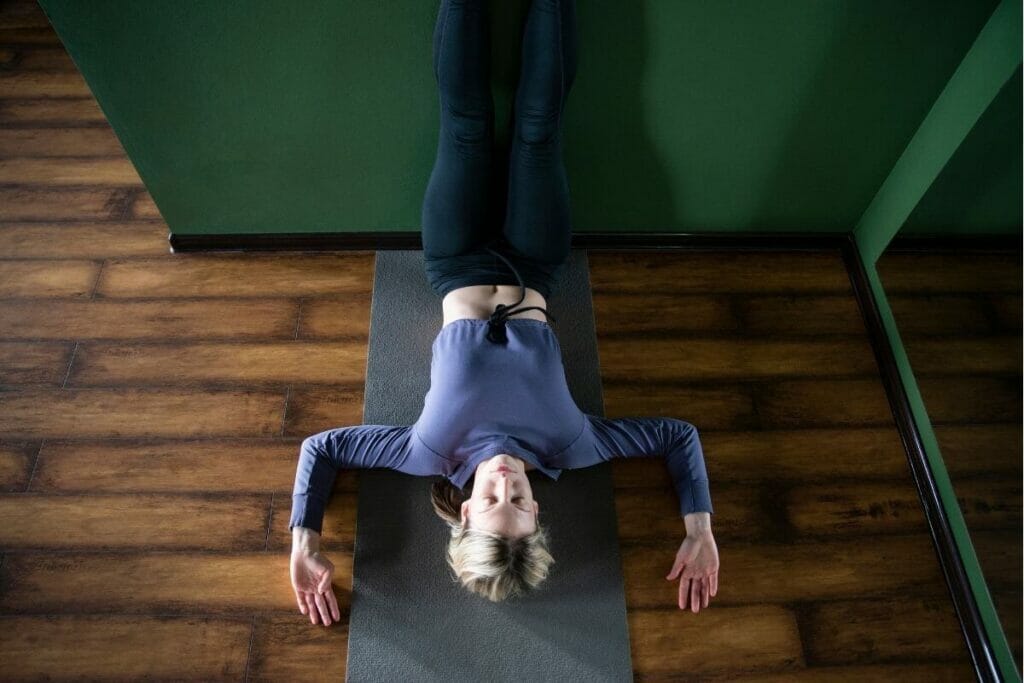 Image of a girl doing leg up the wall yoga pose