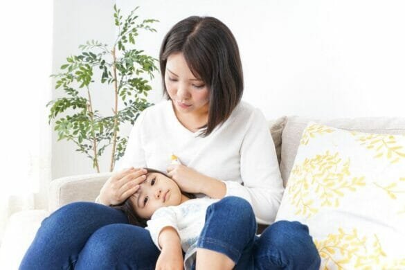 Anxious mother with her sick child