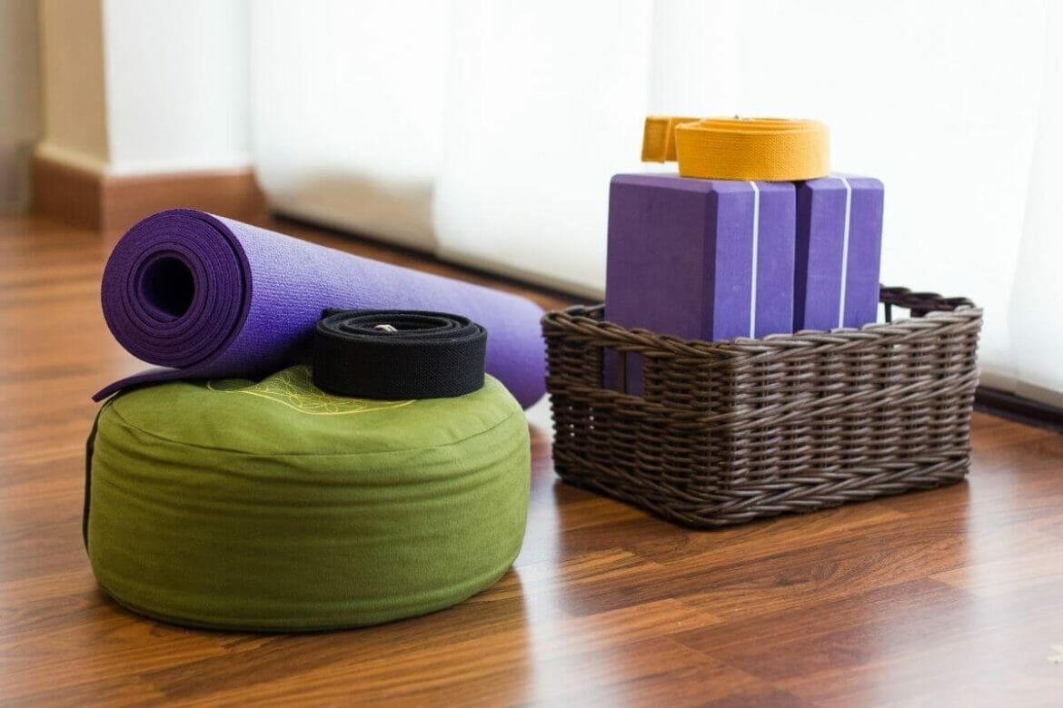 Image of yoga props: mat, strap, blocks, bolsters