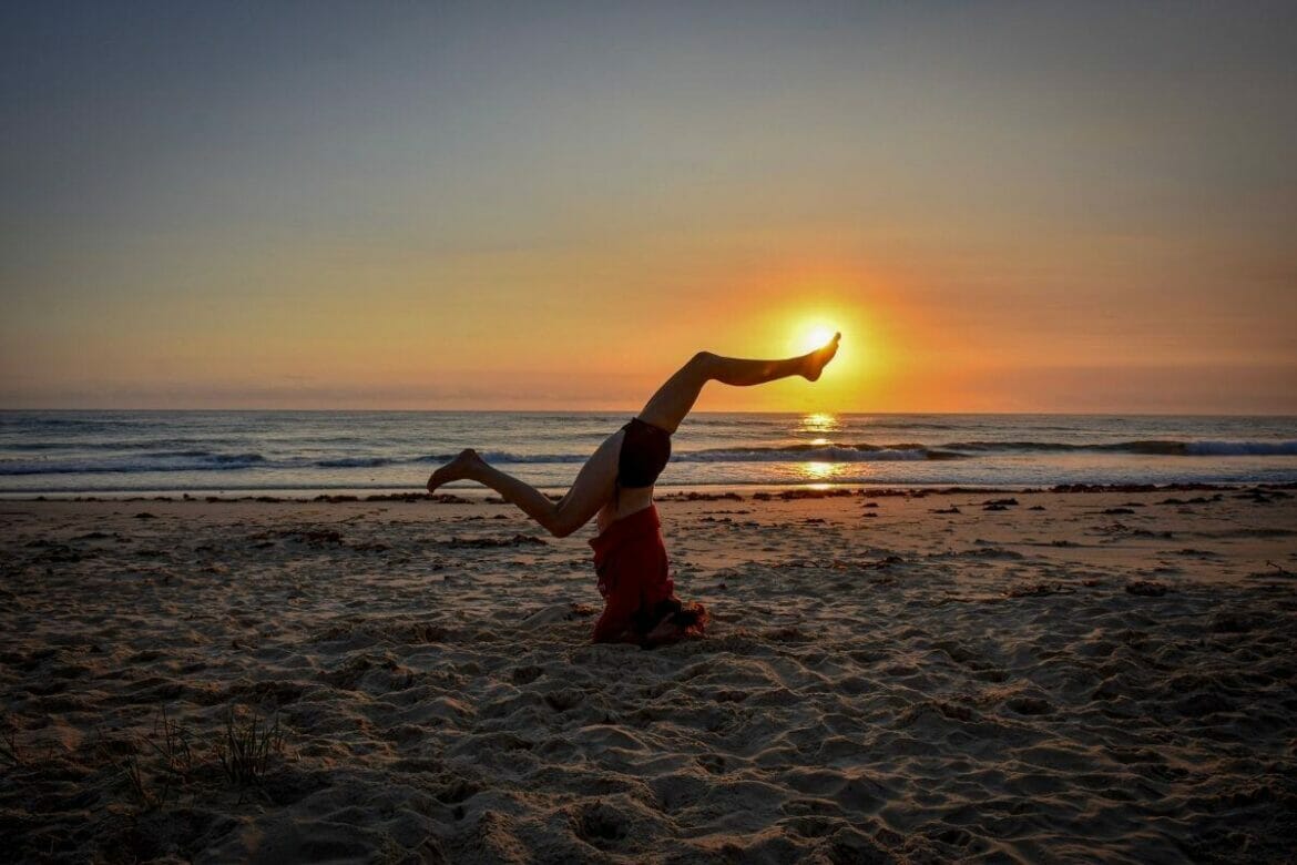 Woman practising yoga inversion pose/asana