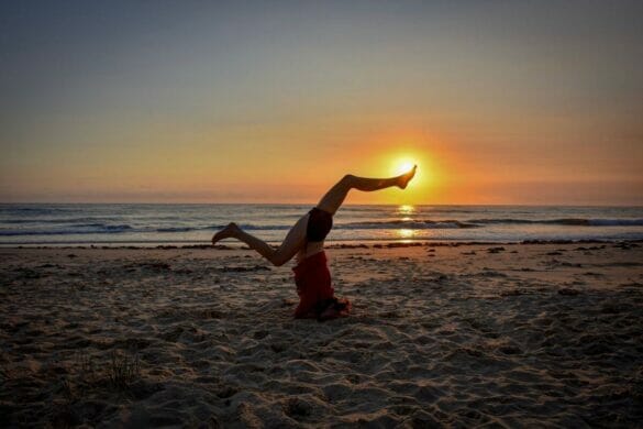 Woman practising yoga inversion pose/asana