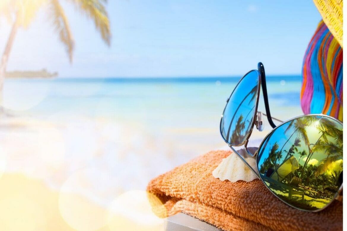 Summer with coolers in a beach background