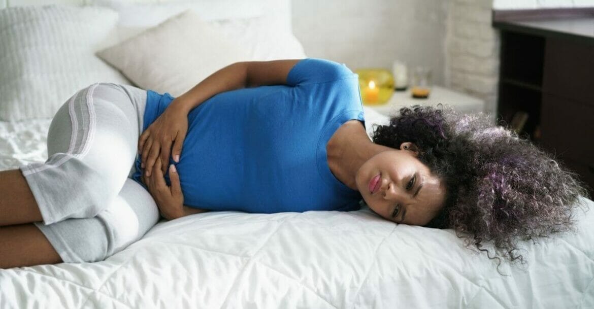 Young woman with menstrual cramps