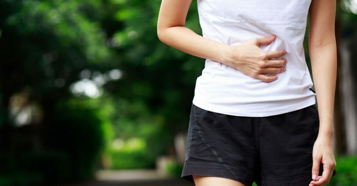 Image of a young woman with abdominal pain