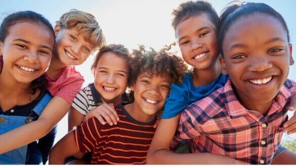 Image of a group of happy teens and pre-teens