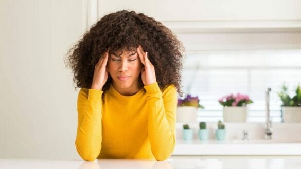 Image of a woman suffering from migraine headache