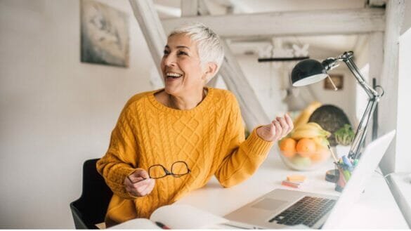 Image of a smiling elderly woman who manages post menopausal osteoporosis
