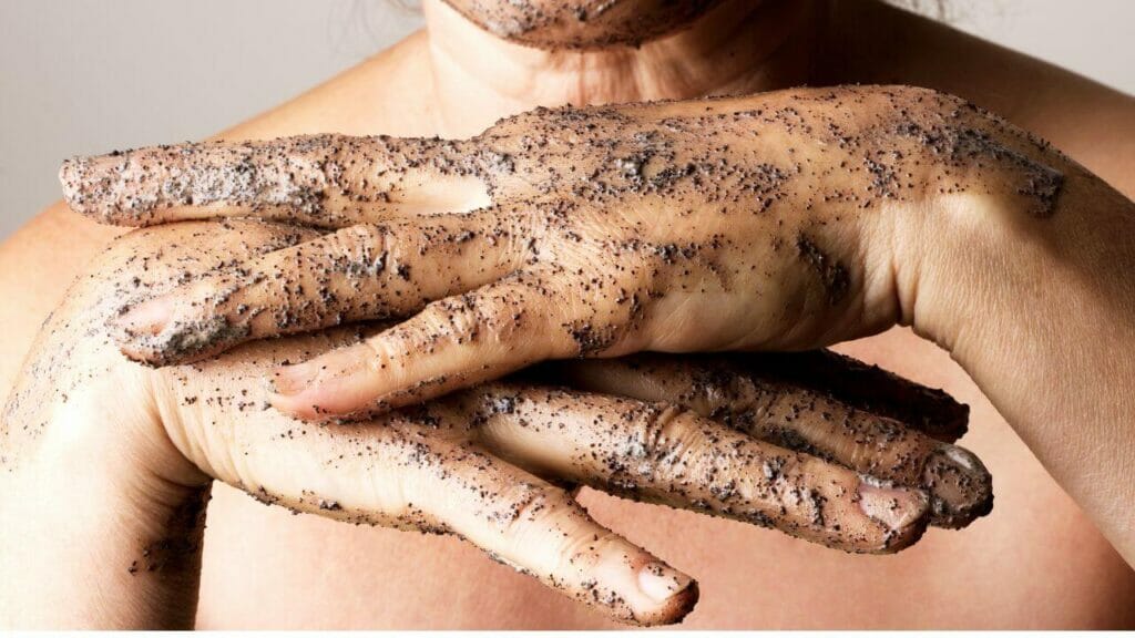 Image of exfoliating scrub on the hands and face - Over exfoliation is a common skincare mistake