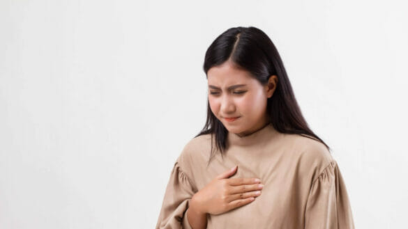 Young woman with heartburn