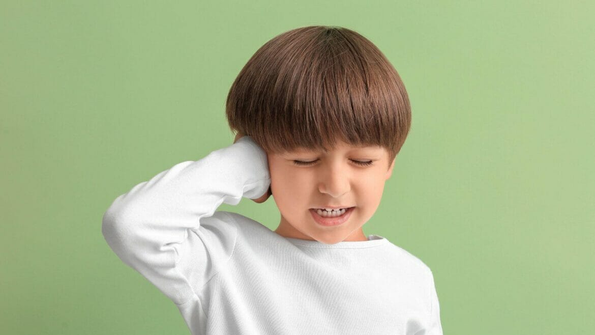 Image of a little boy with ear pain due to cold