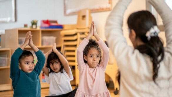 Image of children doing yoga to improve focus and concentration
