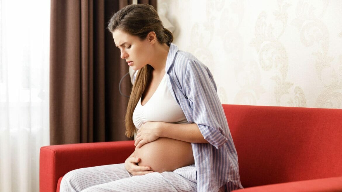 Image of a pregnant woman suffering from constipation