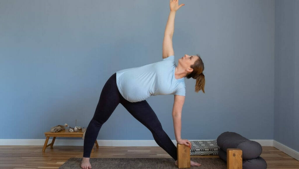 Trikonasana - Pregnancy yoga pose for first trimester 
