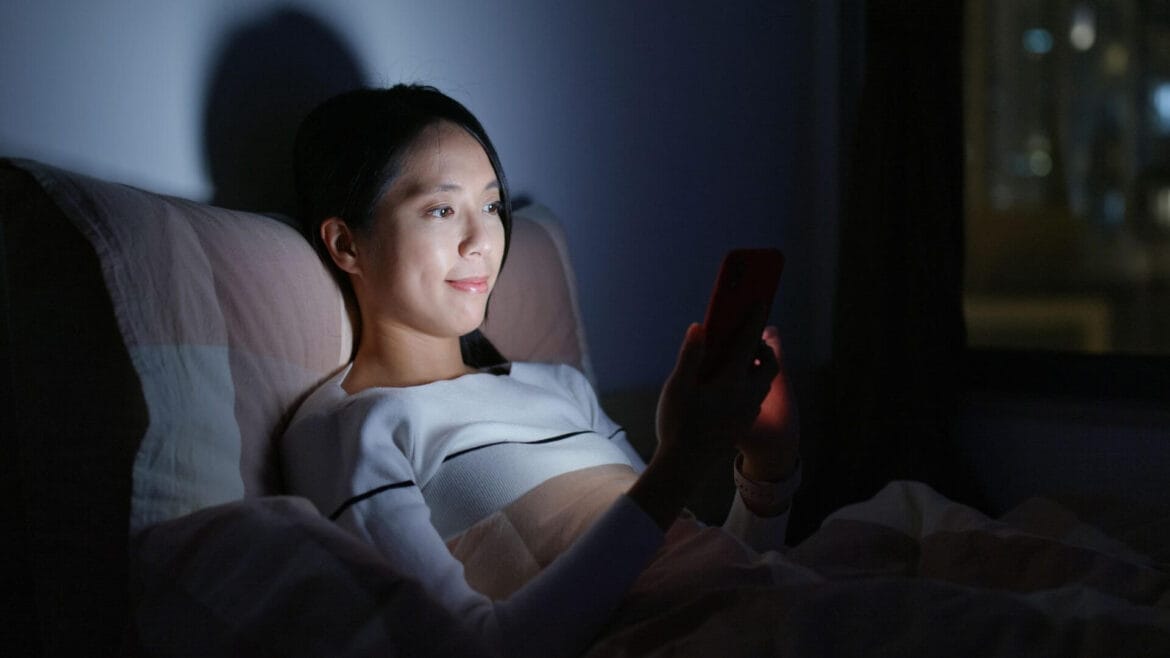 girl-using-mobile-at-bed High-Energy Visible light from mobile phones can cause skin problems