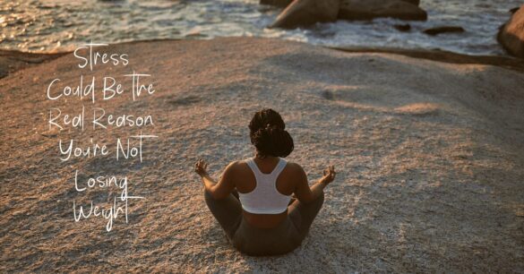 Image of a woman meditating on a beach - stress affects weight loss and belly fat; destressing improves weight management