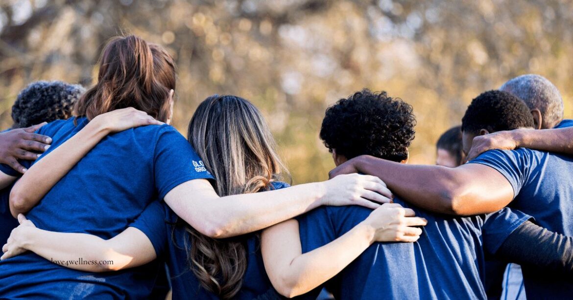 Teenagers standing together with arms over each other's shoulders, representing positive peer pressure